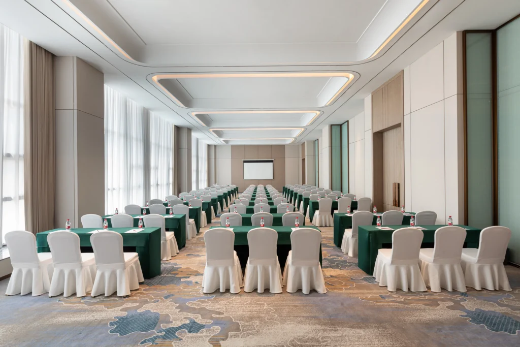 High Traffic Meeting Spaces Modern Hotel Ballroom Interior Design Patterned Carpet Tray Ceiling Recessed Lighting Setup